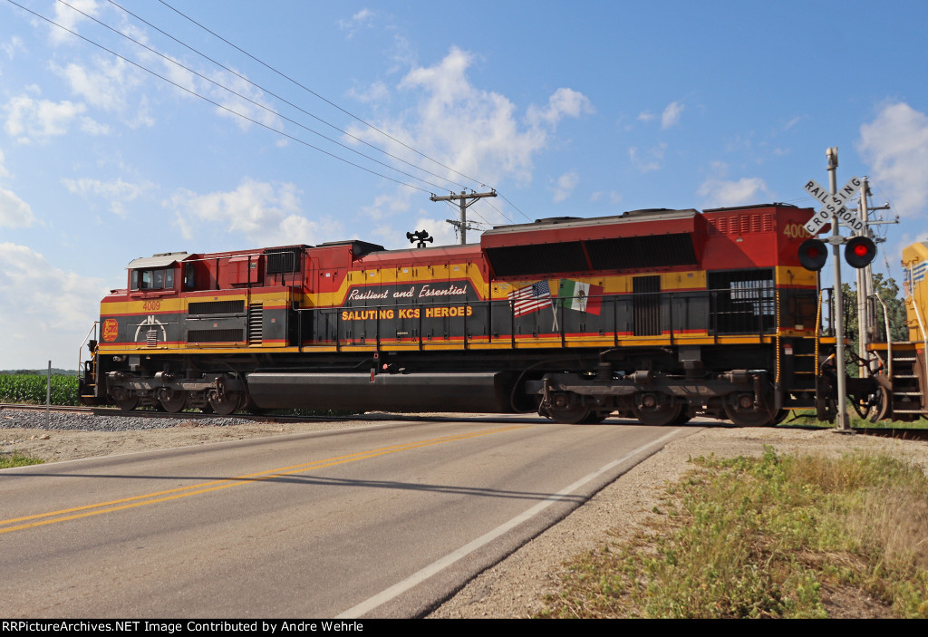A look at the dedication on KCS 4009's long hood as it crosses County H